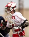 man wearing white and red lacrosse uniform